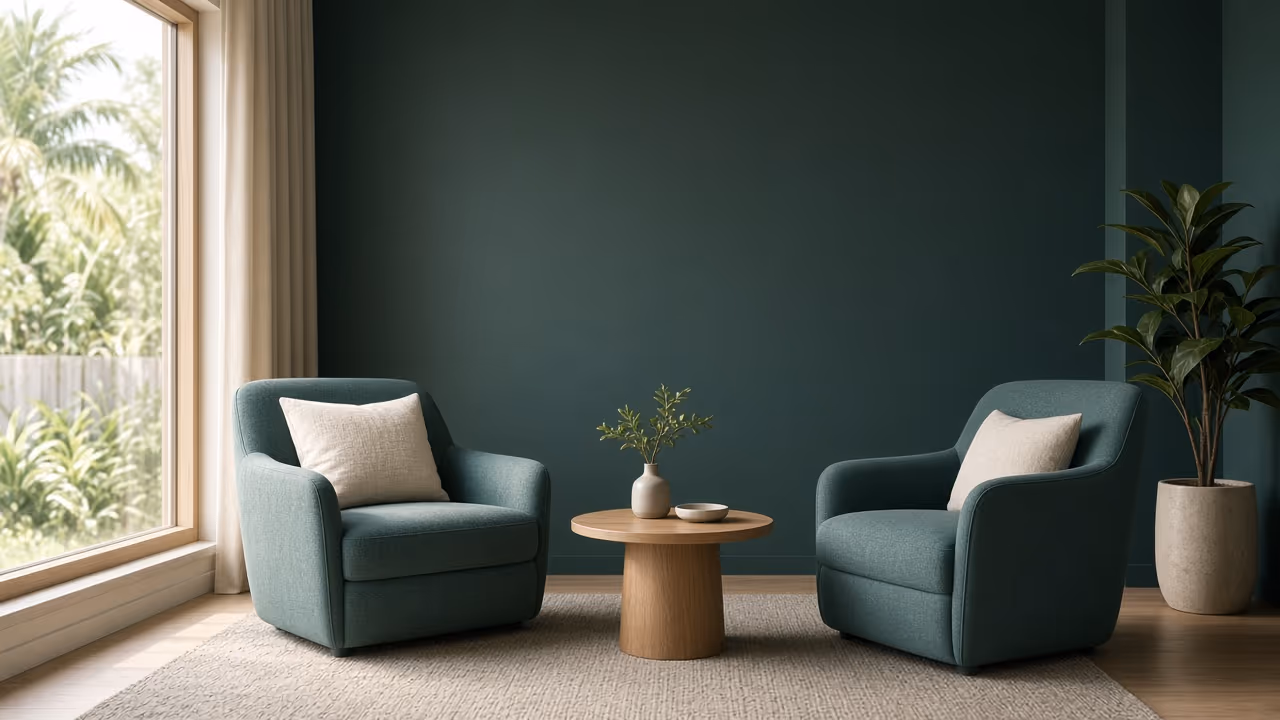 Calm therapy office with two chairs by a window, representing the choice between therapy and life coaching