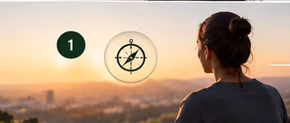 A person looking out over a city at sunrise, with a compass
