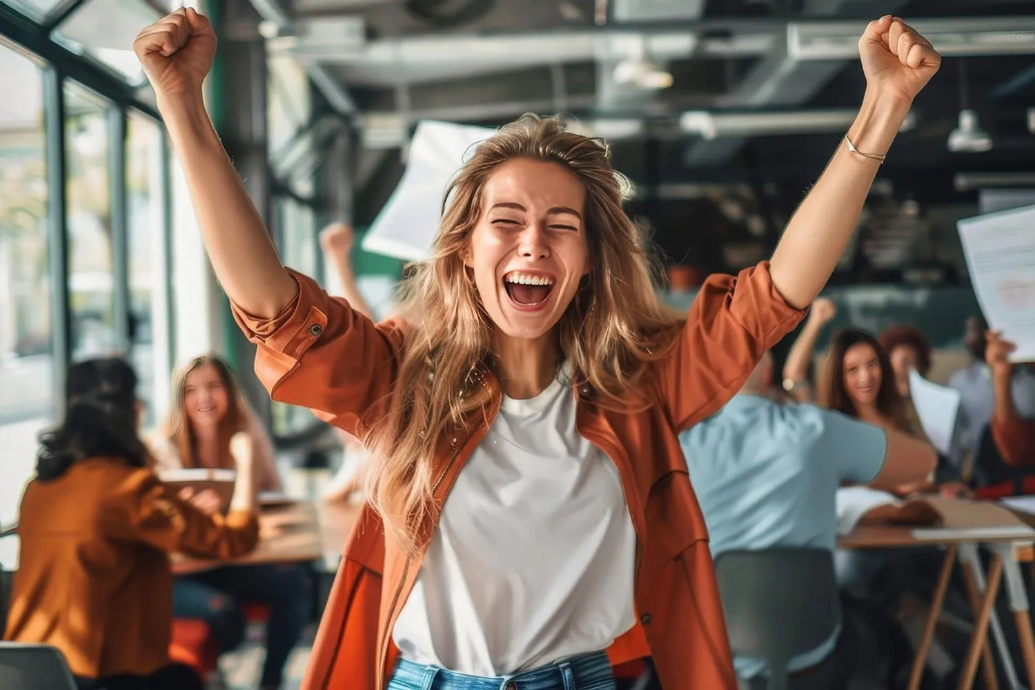a person celebrating their success with a big smile